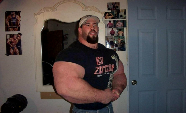 Big, big Man - little white cap.