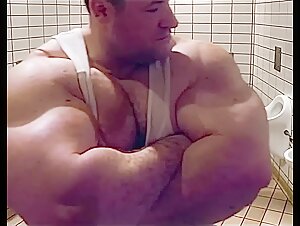Macho massive Biceps in Undershirt