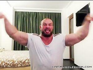 Alpha bodybuilder flexing hard