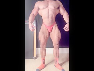 Young aesthetic amateur bodybuilder posing
