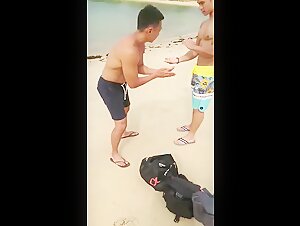 Applying oil on Singaporean hunk